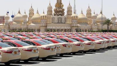 Lines of taxis sit outside Global Village in Dubai. Chris Whiteoak / The National