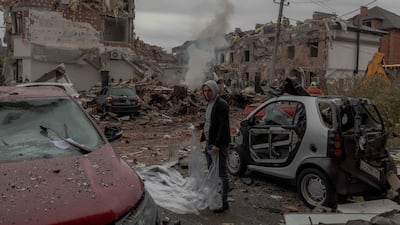 Wrecked cars and destroyed buildings in a scene of devastation after a Russian air attack on the outskirts of Kyiv in 2025. AFP