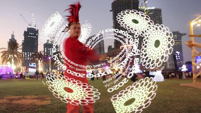 A performance artist dazzles in Burj Park.