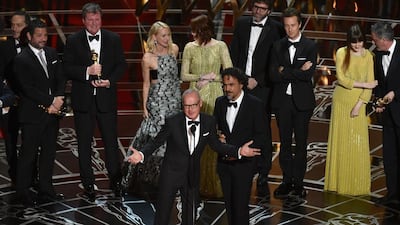 The cast and crew of Birdman, with Michael Keaton at the mic and the director Alejandro Gonzalez Inarritu to his right, accept the award for Best Picture at the Oscars on Sunday, February 22, 2015, at the Dolby Theatre in Los Angeles. John Shearer / Invision / AP Photo
