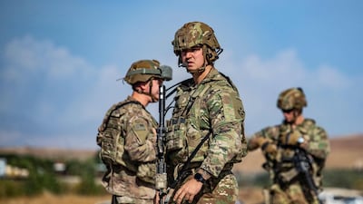US soldiers on patrol an area near Syria's north-eastern Semalka border crossing with Iraq's Kurdish autonomous territory in 2021. The US has retained a combat presence in Iraq since 2003 to provide assistance in its war against ISIS. AFP