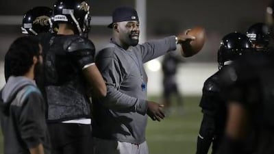 Abu Dhabi Wildcats coach Charle Gillespie instructs his players during one of the last practices this week before the league's Desert Bowl on Friday. Delores Johnson / The National