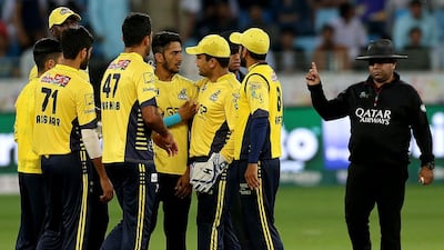Peshawar Zalmi celebrates the dismissal of Mohammad Nawaz of Quetta Gladiators plays a shot during their match against Peshawar Zalmi during the 2nd round of the PSL match at the Dubai International Cricket Stadium ON fEBRUARY 25, 2017. Satish Kumar / The National