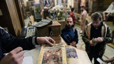 At Hammam Al Qawwas, a traditional Turkish bathhouse in the Syrian city of Aleppo, a worker presents a pamphlet on the facilities available inside. All photos: AFP