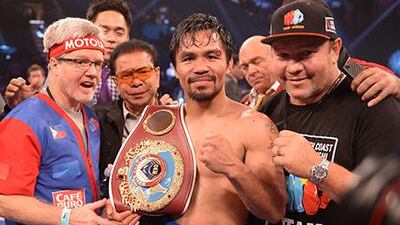 Manny Pacquiao won the WBO Welterweight title after a big win over Timothy Bradley. Joe Klamar / AFP
