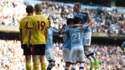 Manchester City's Portuguese midfielder Bernardo Silva celebrates with teammates after he scores the team's seventh goal. EPA