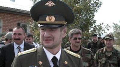 In this file photo, Sulim Yamadayev, center, is seen at Hankala airport, a military base outside Grozny, Chechnya, southern Russia. Yamadayev was shot in Dubai on Saturday.