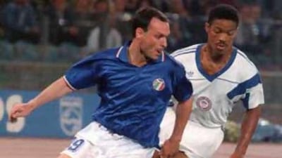 Salvatore Schillaci beats Jimmy Banks, of the US, to the ball during the 1990 World Cup in Italy.