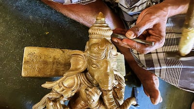 A sculptor making a Ganesh idol. The tradition using 'lost' wax is being kept alive by artisans in Swamimalai, India. All photos: Veidehi Gite