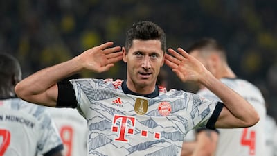 Robert Lewandowski celebrates after scoring Bayern's third goal - and his second - against former club Dortmund.