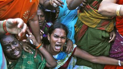 Supporters of J Jayalalithaa, former chief minister of India's Tamil Nadu state and chief of the AIADMK party, protest against her conviction for corruption outside a court in the southern Indian city of Chennai on September 27. Reuters