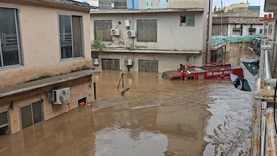 A firetruck submerged in floodwater. AP