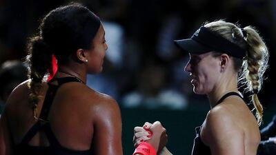 Angelique Kerber, right, greets Naomi Osaka at the net after their WTA Finals match on Wednesday. Getty Images