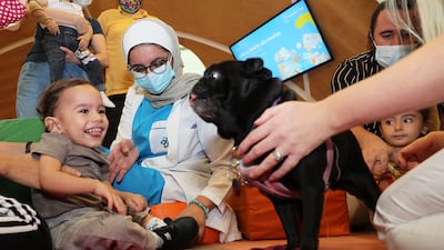 Children enjoy meeting Millie the Pug.