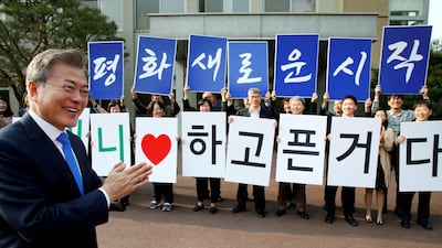 South Korean President Moon Jae-in applauds in Seoul before departing for the truce village of Panmunjom inside the demilitarized zone separating the two Koreas, South Korea. Korea Summit Press Pool / Pool via Reuters