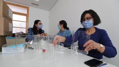 Volunteer Tunisian doctors prepare protective medical equipment for full-time staff fighting the coronavirus in Tunisian hospitals in Tunis. EPA