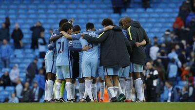 Manchester City players huddle after the game. Craig Brough / Action Images / Reuters