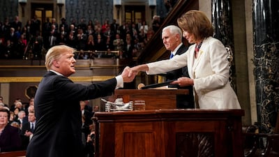 Donald Trump shakes hands with Speaker of the House Nancy Pelosi. Reuters