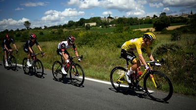 Slovenia's Tadej Pogacar, wearing the leader's yellow jersey, during Stage 12.