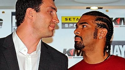 Wladimir Klitschko, left, of Ukraine, and David Haye of Great Britain stare each other down during a news conference in London, previewing their title unification fight on July 2 at Hamburg, Germany.