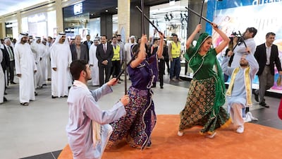 Dancers add to the festive atmosphere are Nakheel officials and guests tour the Ibn Battuta Mall extension. Antonie Robertson / The National