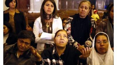 Coptic Christian women gather for Christmas Eve Mass at Abassiya Cathedral in Cairo on Thursday night.