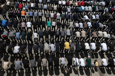 Palestinians pray at the funeral of the teenagers, in the occupied West Bank village of Al Mughayyir. EPA