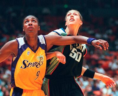 Los Angeles Sparks's Lisa Leslie, left, and New York Liberty's Rebecca Lobo battle for rebound position during a WNBA game in 1997. AP Photo