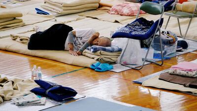 An evacuee takes rest at Okada elementary school that is used as an evacuation centre in Mabi town in Kurashiki, Okayama Prefecture, Japan on July 12, 2018. Reuters