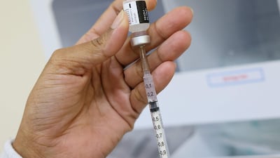 A nurse prepares a dose of the Pfizer-BioNTech vaccine at al-Barsha Health Centre in Dubai. AFP