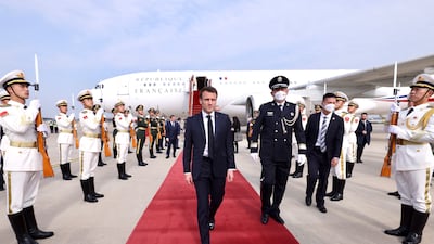Emmanuel Macron arrives at Beijing Capital International Airport. EPA