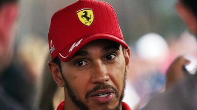 Ferrari's Lewis Hamilton is interviewed after finishing sixth. Reuters