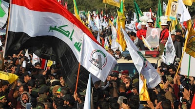 Mourners surround a car carrying the coffin of Iraqi paramilitary chief Abu Mahdi al-Muhandis during a funeral procession, for him and nine others, in Baghdad's district of al-Jadriya, near the high-security Green Zone. AFP
