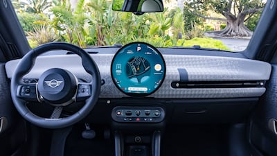 The highlight is an OLED circular centre screen, plus recycled textile trims in the dashboard and door panels