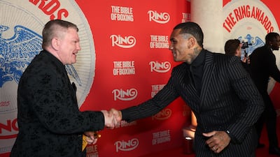 Conor Benn, right, shakes hands with Ricky Hatton. Getty Images