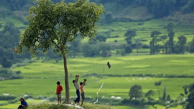 Nepalese children fly a kite from a hill in the fields surrounding the Khokana village near Kathmandu, Nepal. According to Hindu mythology, Nepalese start flying kites after rains have stopped and finishing the summer season with the message to spread that ‘monsoon is over”. Narendra Shrestha / EPA
