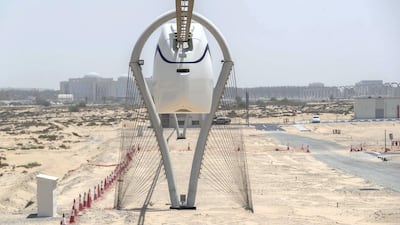 An end view of the uCar on the suspended test track at Sharjah. Developer uSky Transport is working on a system that can both run cargo and passenger vehicles.