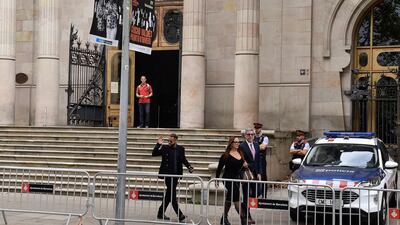 Neymar gestures as he leaves after attending the opening audience at the courthouse in Barcelona. AFP