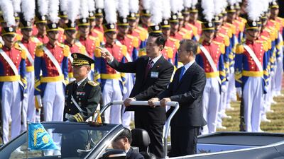 South Korean President Moon Jae-In and Defense Minister Song Young-Moo review the troops during a commemoration ceremony marking South Korea's Armed Forces Day, which will fall on October 1, at the Second Fleet Command of Navy in Pyeongtaek. Jung Yeon-Je / Reuters