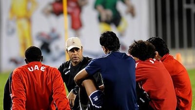UAE coach Mahdi Ali talks to his players in training.