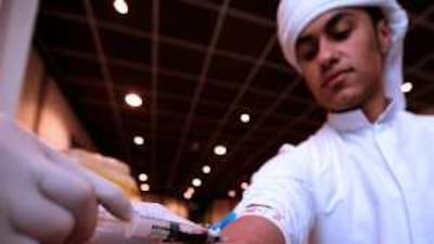 Students at the Sharjah University Mens' College, the Higher College of Technology, have their blood test for thalassaemia.