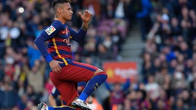 Barcelona’s Brazilian forward Neymar celebrates after scoring during the Spanish league football match FC Barcelona vs Getafe CF at the Camp Nou stadium in Barcelona on March 12, 2016. AFP / LLUIS GENE