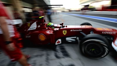 Ferrari's Felipe Massa leaves the pits during the first practice session. Dimitar Dilkoff/AFP