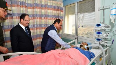 Egyptian president Abdel Fattah El Sisi visit a police officer who was wounded in a militant attack in the Western Desert on October 21, 2017. The Egyptian Presidency via Reuters
