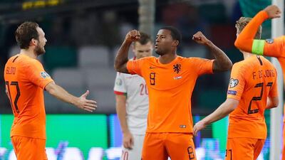 Netherlands' Giliano Wijnaldum, centre, celebrates after scoring against Belarus at the Dinamo Stadium in Minsk. Associated Press