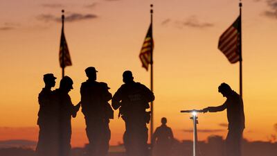 Members of the National Guard patrol the National Mall, weeks after US President Donald Trump stepped up the presence of federal law enforcement to assist in crime prevention, in Washington, DC. Reuters