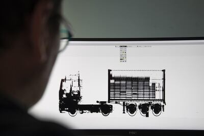 A customs worker inspects an x-ray image of Mr Maretac's lorry