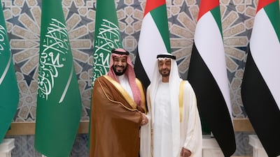 Sheikh Mohamed bin Zayed and Prince Mohamed bin Salman stand for a photograph during a state visit reception.