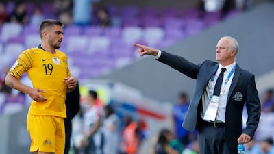 Australia head coach Graham Arnold, right, gives instructions from the sidelines. AP Photo