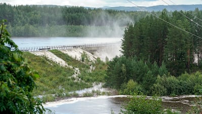 A dam overflows at the Braskreidfoss hydroelectric power plant in Norway after Storm Hans battered parts of Scandinavia and the Baltics. EPA